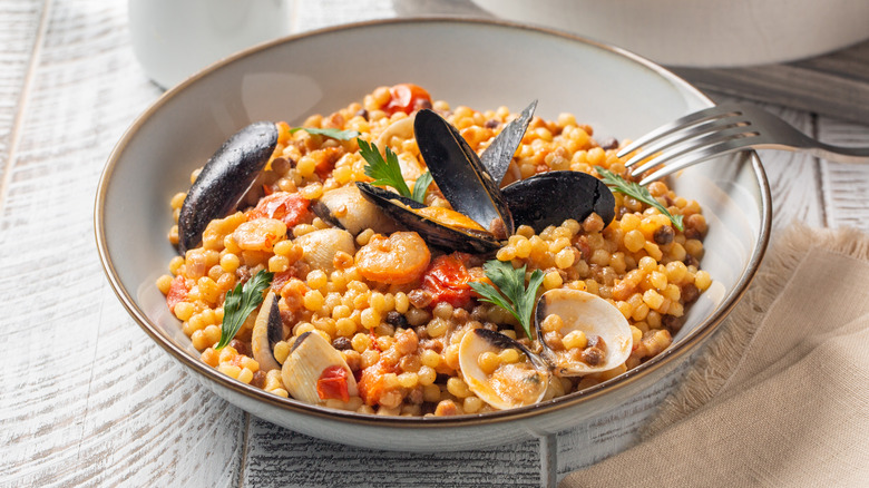 Bowl of fregula with clams