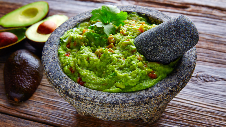 guacamole in mortar with pestle