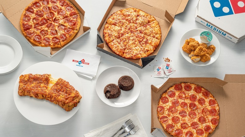Several Domino's pizzas and sides