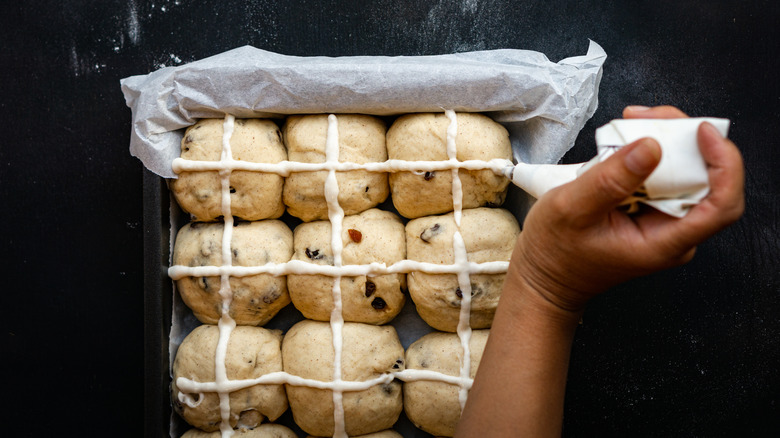 Piping on hot cross buns