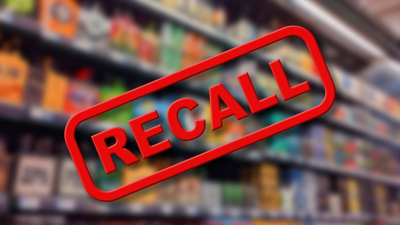 blurry grocery store aisle and red "recall" stamp