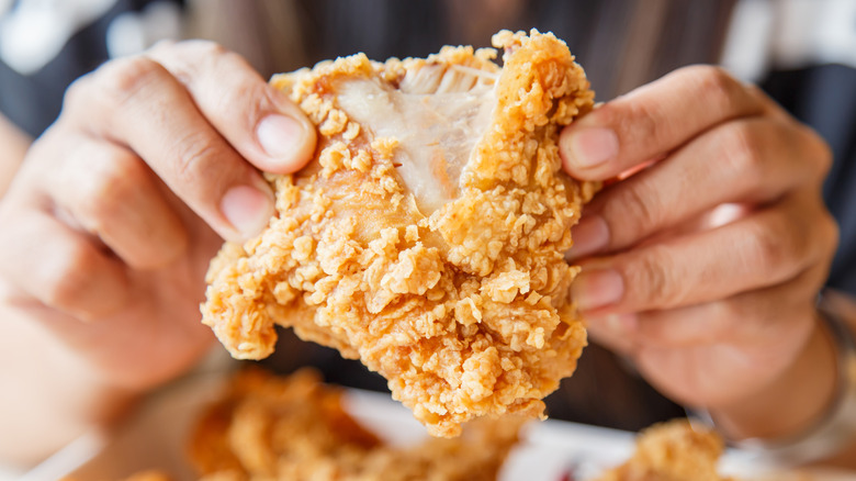 tearing fried chicken apart
