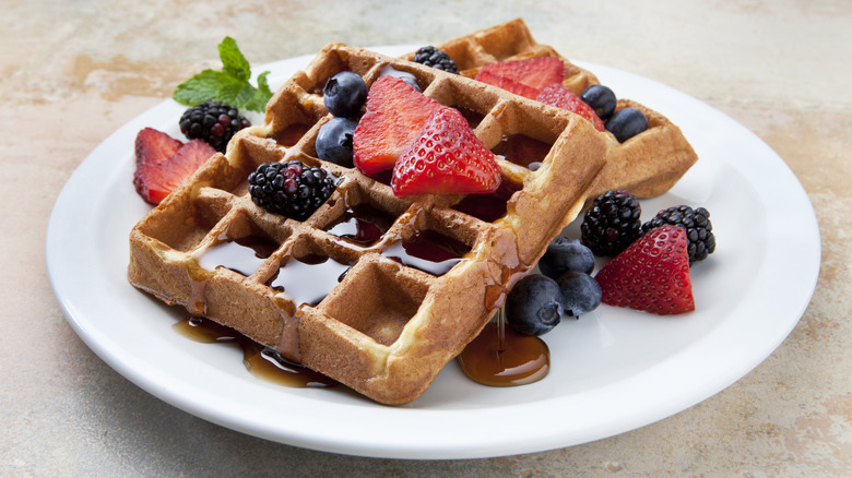 Waffles with berries and syrup