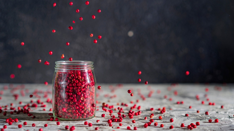 pink peppercorns in a jar