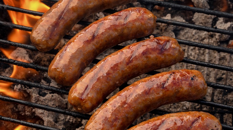 Bratwursts on a grill