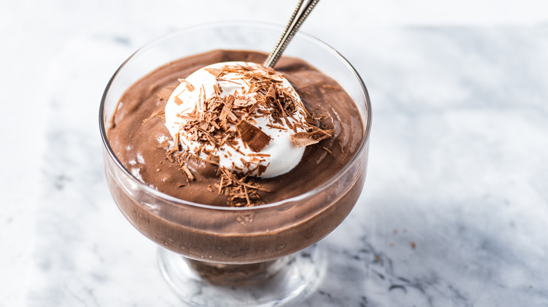 Chocolate mousse with whipped cream and chocolate shavings