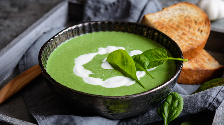 Spinach soup with a swirl of cream