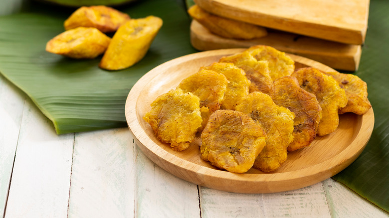 plate of tostones on plantain leaves
