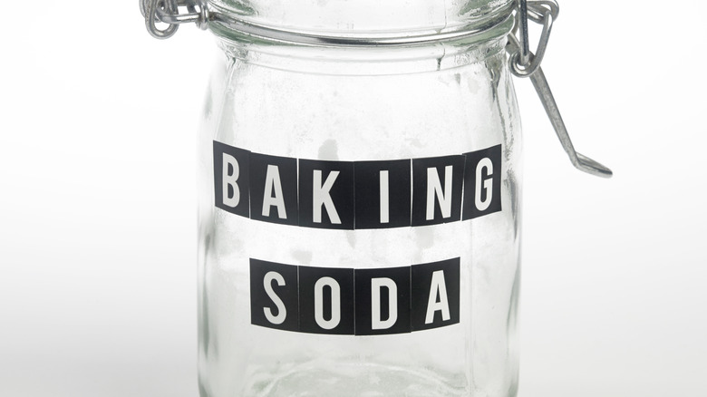 Empty baking soda glass jar