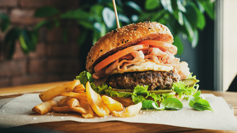 A closeup of a burger and fries