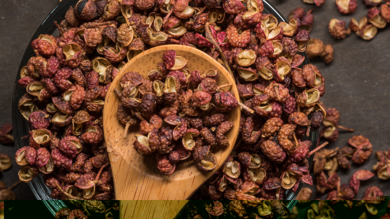 Pile of sichuan peppercorns on wooden spoon