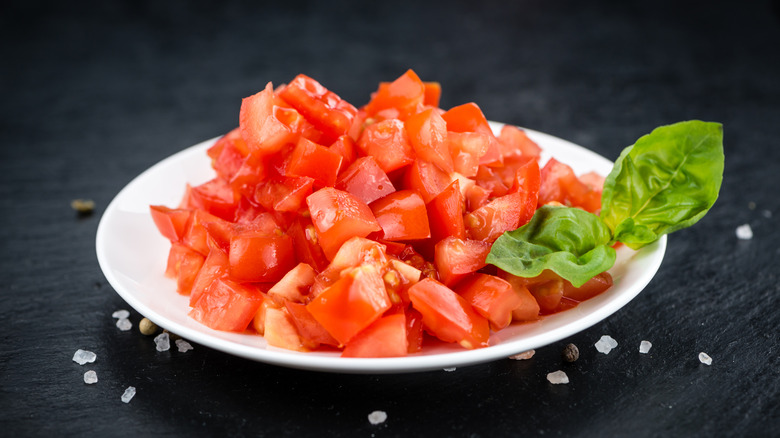 chopped tomato pieces on a plate