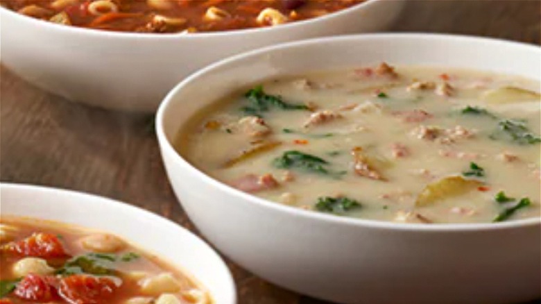 Olive Garden Zuppa toscana soup with other bowls of soup