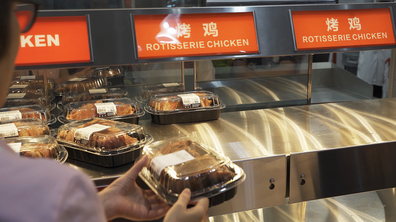 Customer taking Costco Shanghai rotisserie chicken