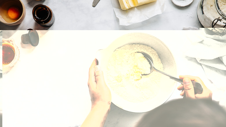mixing bowl filled with flour and butter