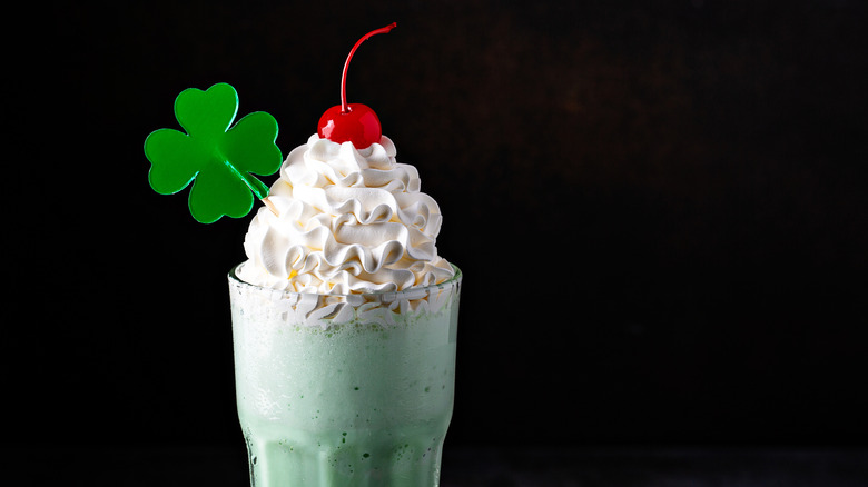 Shamrock shake with cherry and plastic clover