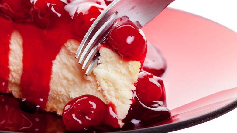 A plate of cherry cheesecake