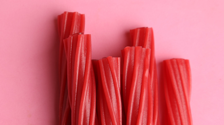 red licorice against pink background