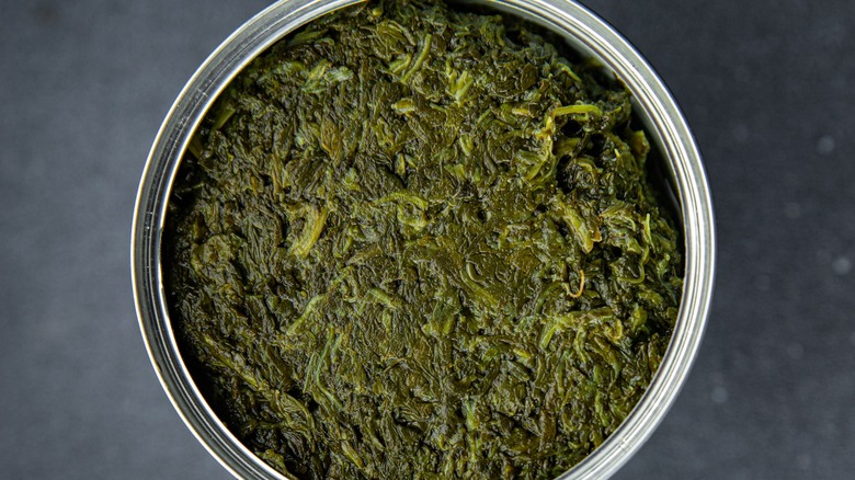 Birds-eye view of open canned spinach