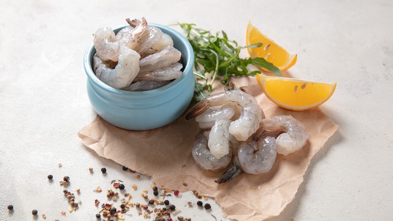 Raw shrimp with arugula, lemon, and peppercorns
