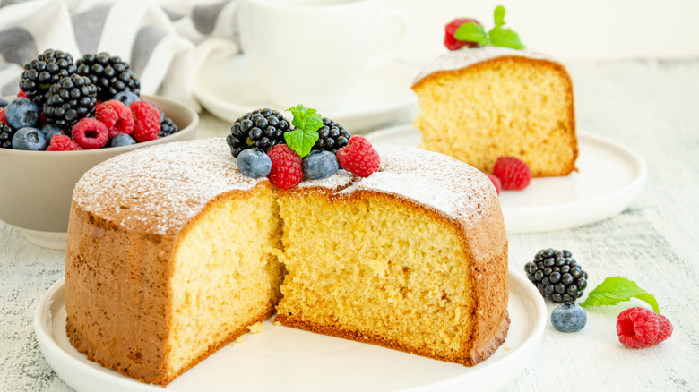 vanilla sponge cake on white plate fresh fruit topping