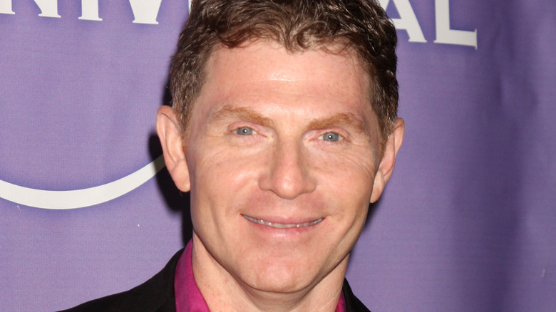 Bobby Flay smiling at event