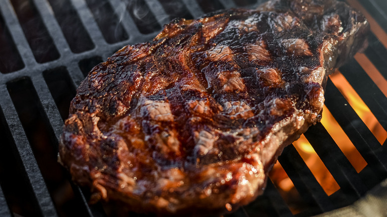 steak on grill with grill marks