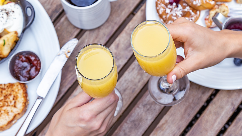 Two mimosas on a brunch table.