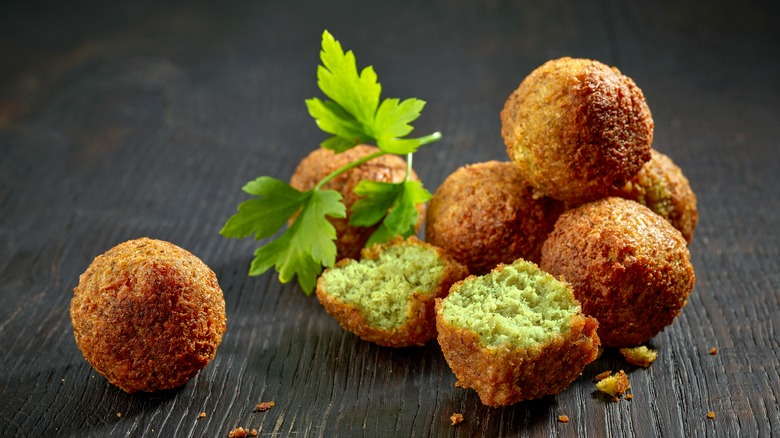 falafel with parsley on wood background