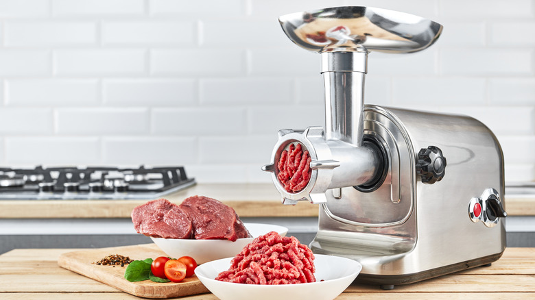 Meat grinder next to meat