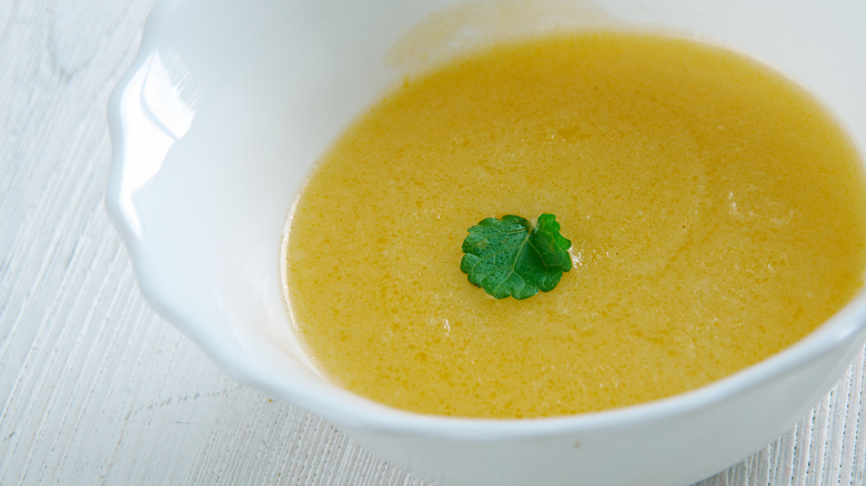 Bowl of veloute garnished with parsley