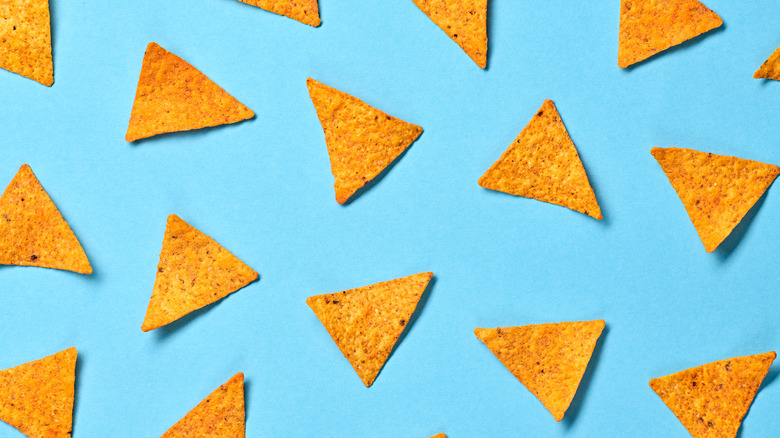 Doritos chips decorating a light blue background