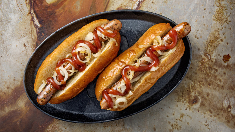 Hot dogs with ketchup and onions