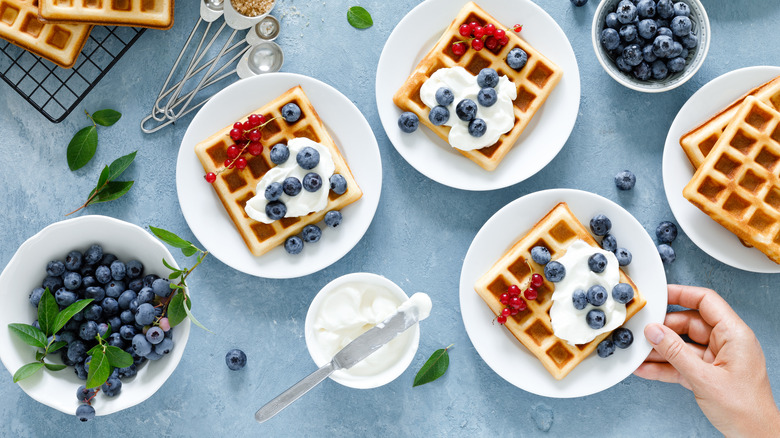 waffles with whipped cream and berries