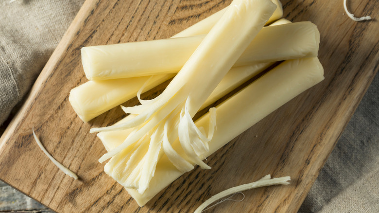 White string cheese partially peeled 