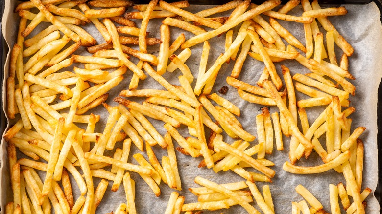 crispy french fries on parchment paper