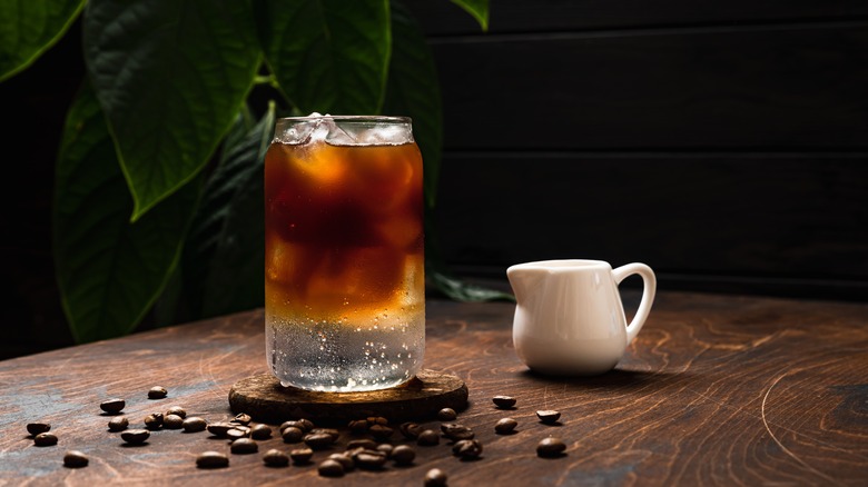 Espresso tonic and coffee beans