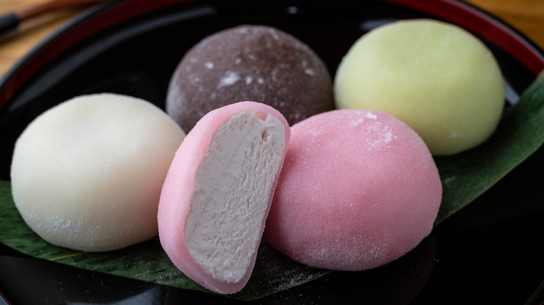 four mochis on a plate