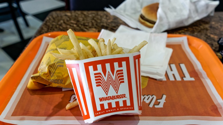 Whataburger fries and burger on tray