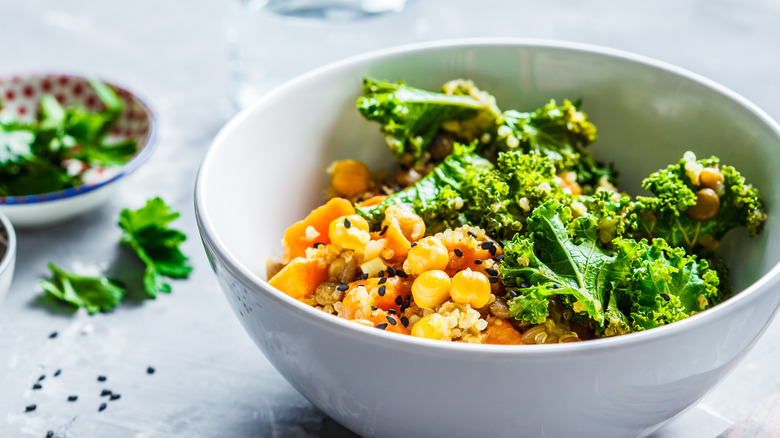 Kale and chickpea salad in white bowl