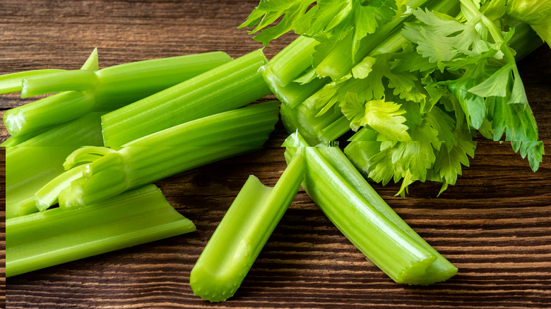 Cut celery stalks on board