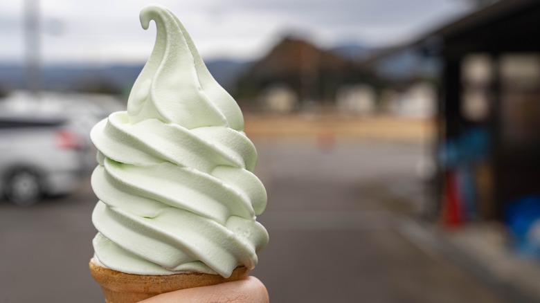 wasabi ice cream cone held in air