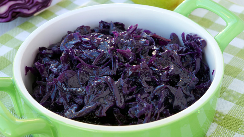 bowl holding blue sauteed cabbage