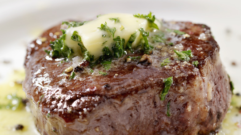 steak topped with butter