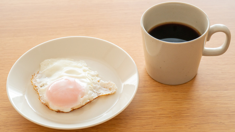 Over easy egg and coffee