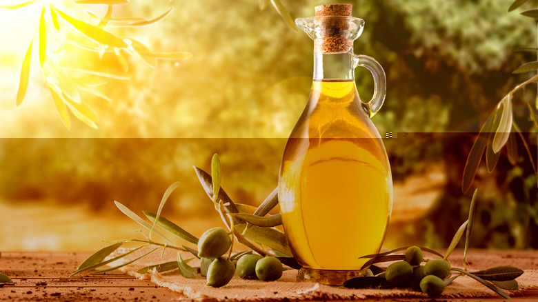 olive oil bottle and olives