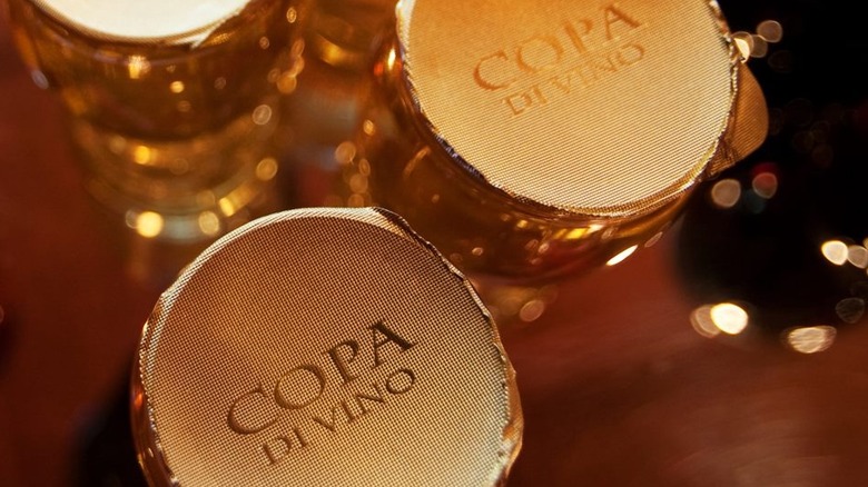tops of copa di vino bottles