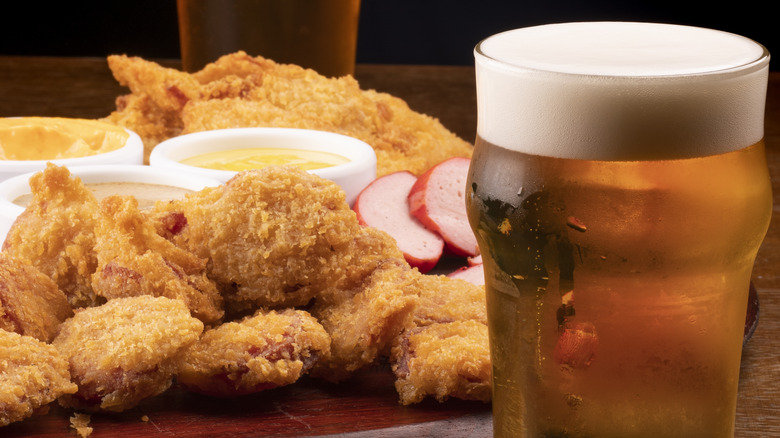 Glass of beer and fried chicken