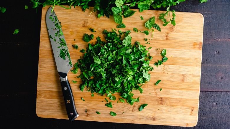 fresh herbs on cutting board 
