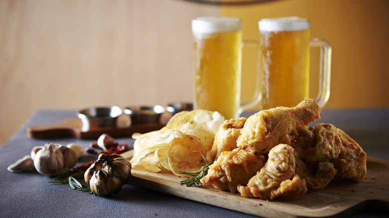Beer with fried chicken and chips
